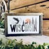 Wisconsin Farmhouse Framed Wood Sign – Deer, Fish & Pine Tree Design – Cabin Wall Art, Lake House Decor, Nature Lover Gift